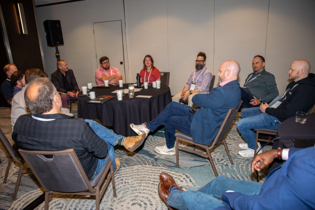 Group of people seated in chairs in a semicircle